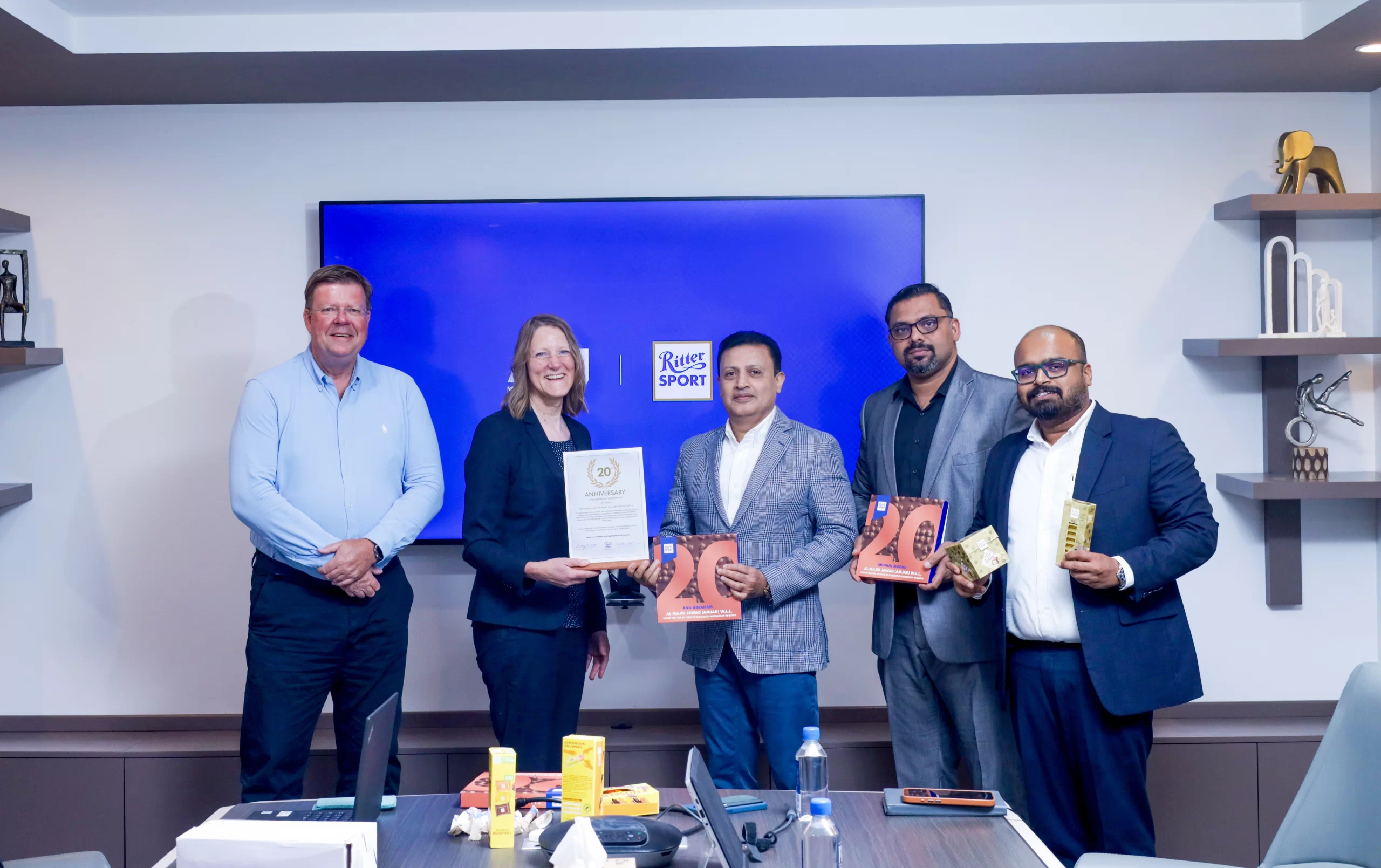 AMJ and Ritter Sport representatives marking a 20-year partnership